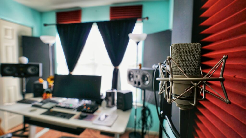 Laboratory evaluation of curved acoustic microphone shields: measuring rear refl