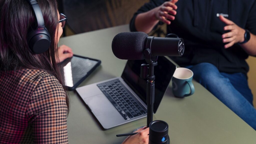 Eliminating distracting audio latency and headphone bleed in multi-host podcast